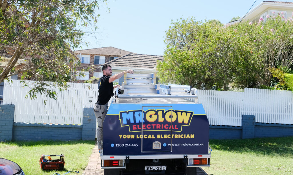 Mr Glow Electrical checking the ladder.