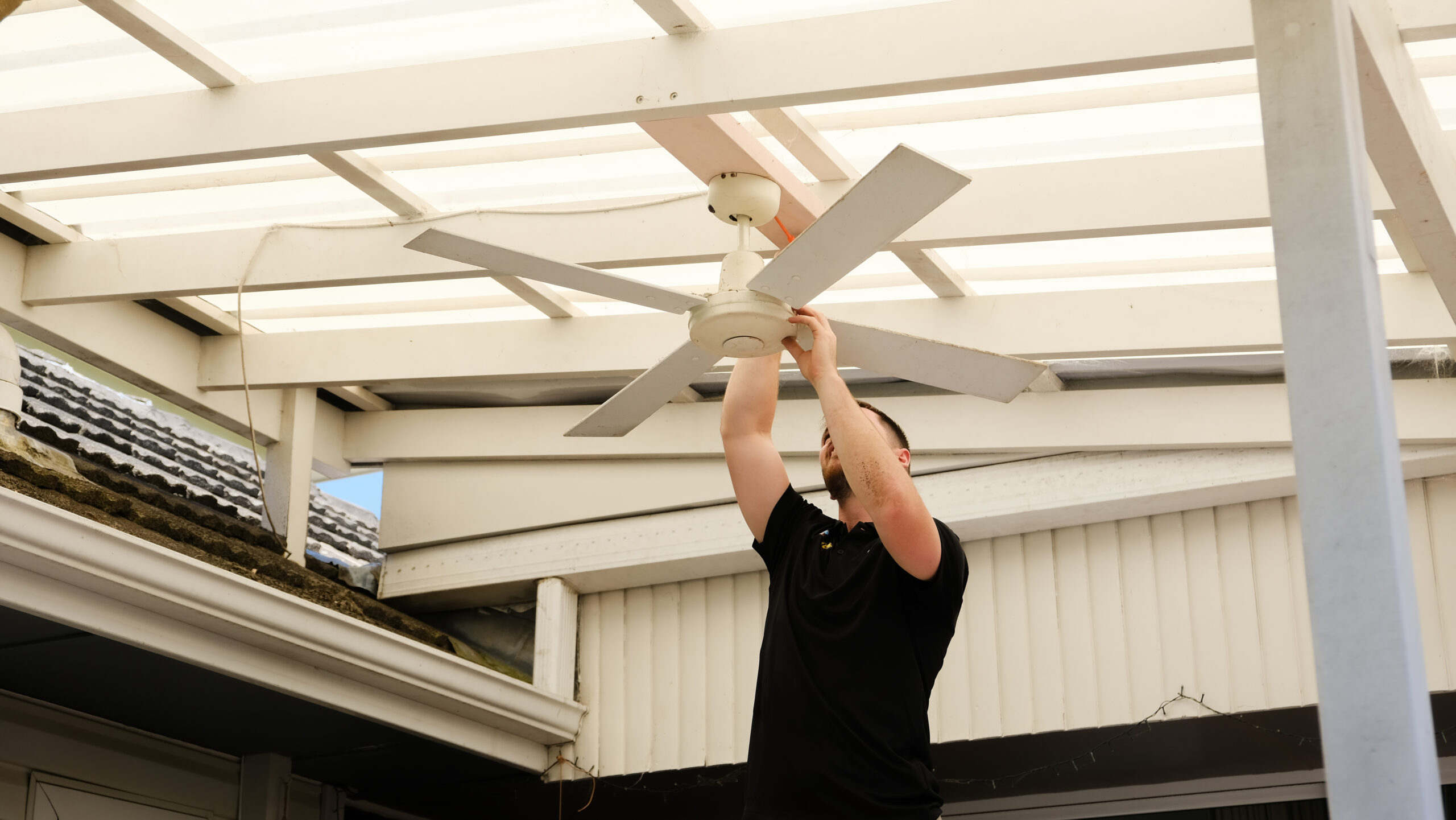Mr Glow Electrical installing ceiling fan.